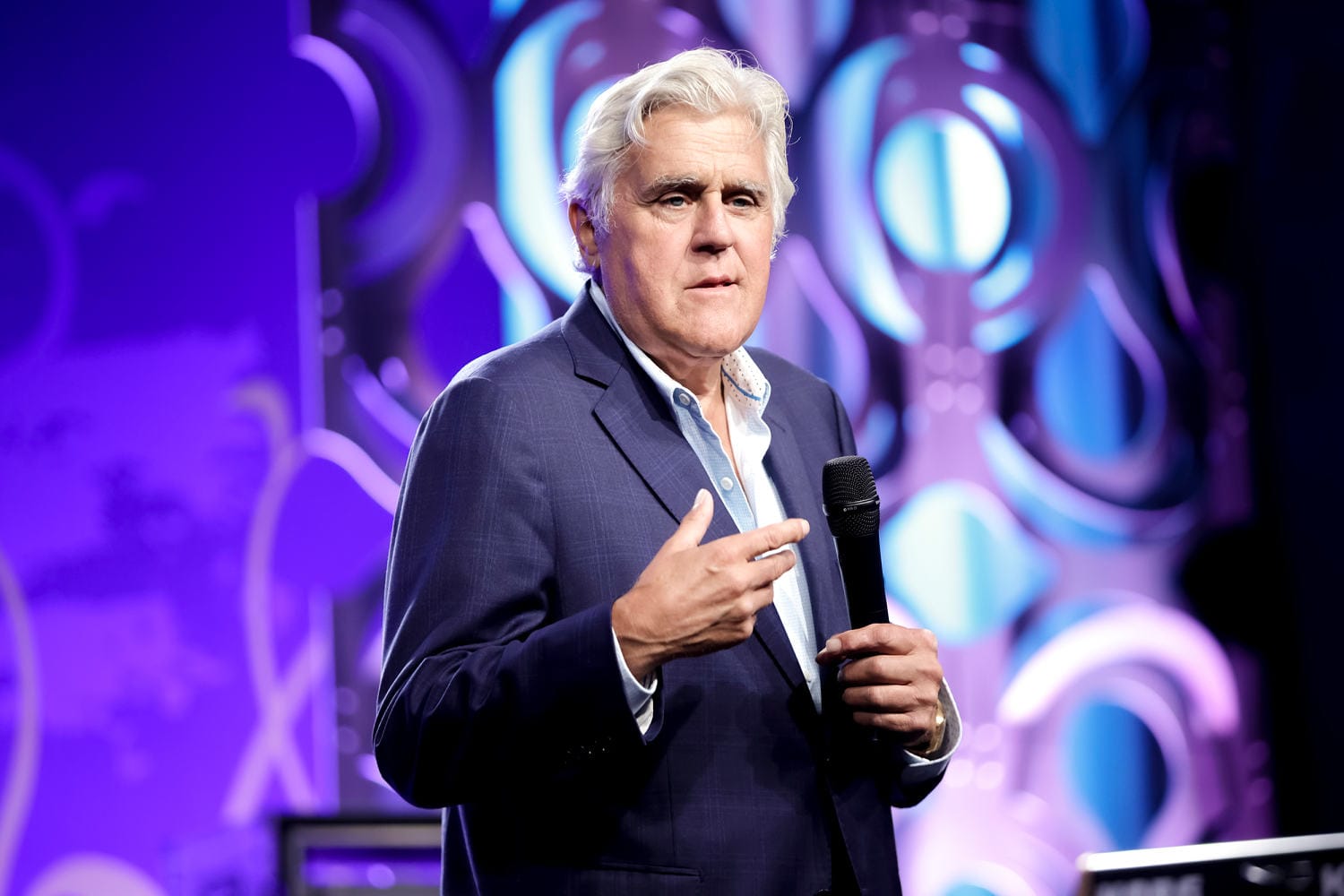 Jay Leno exhibits up with bruised face and a watch patch to comedy present after fall