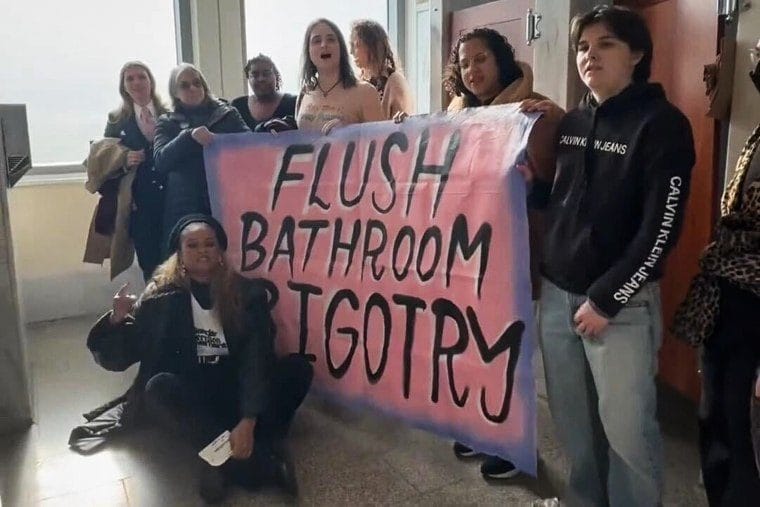 Transgender advocates stage a sit-in protest at a U.S. Capitol toilet